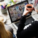 woman hands holding coffee cup working on laptop 2023 11 27 05 13 01 utc 2